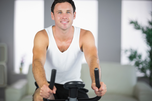 man exercising on bike